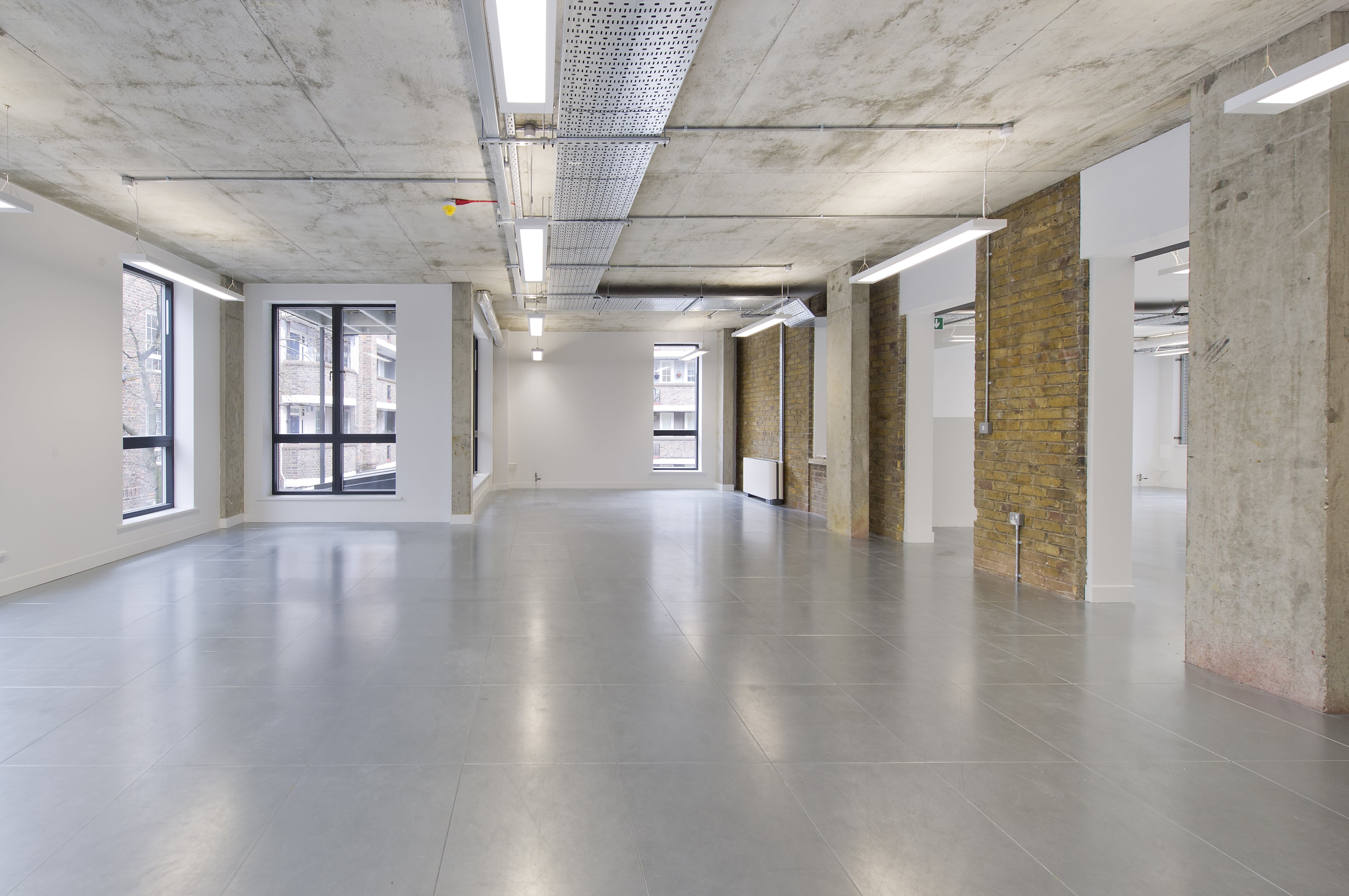 Cat A grade office space with white wash walls and soft brick features